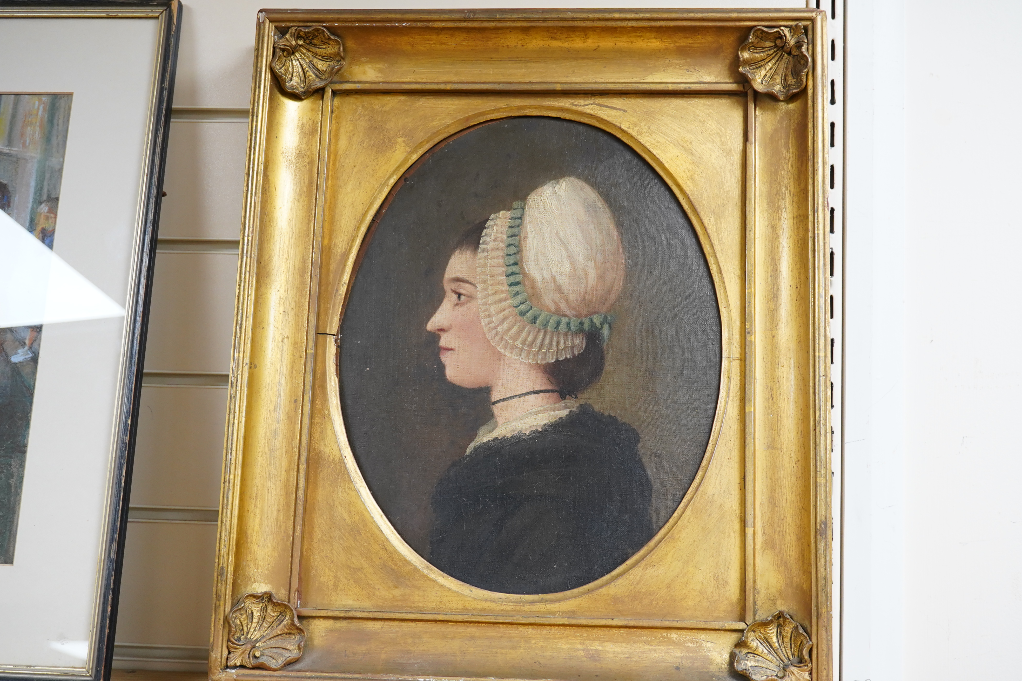 19th century English School, oval oil on canvas, Portrait of a lady, G.A. Rose Restoration label verso, 33 x 28cm, housed in applied shell design gilt frame. Condition - fair to good